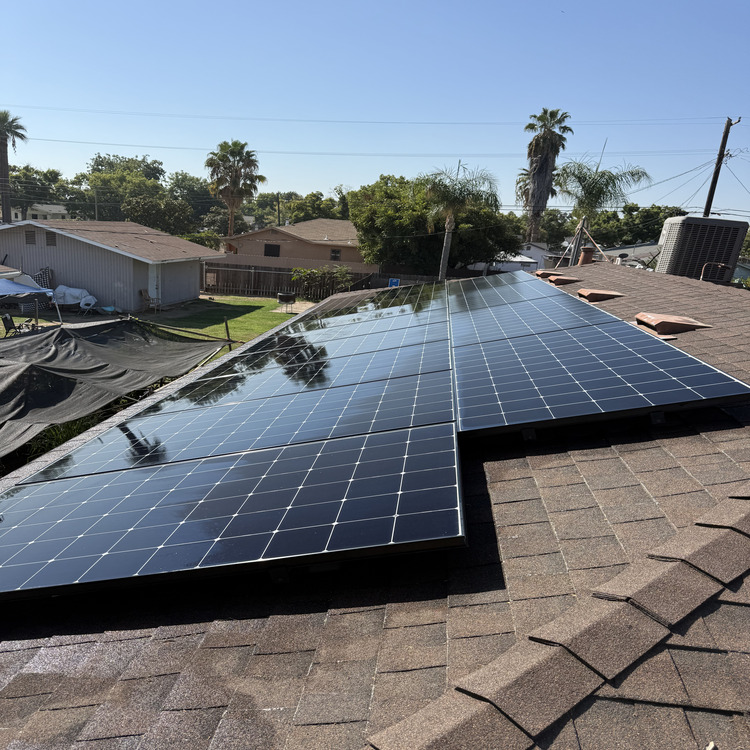 Rooftop solar array being cleaned